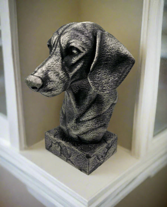 A black and silver 3D printed bust of a Dachshund dog