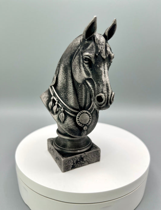 A 3D printed black and silver bust of a horse with a decorative collar, displayed on a white circular base.