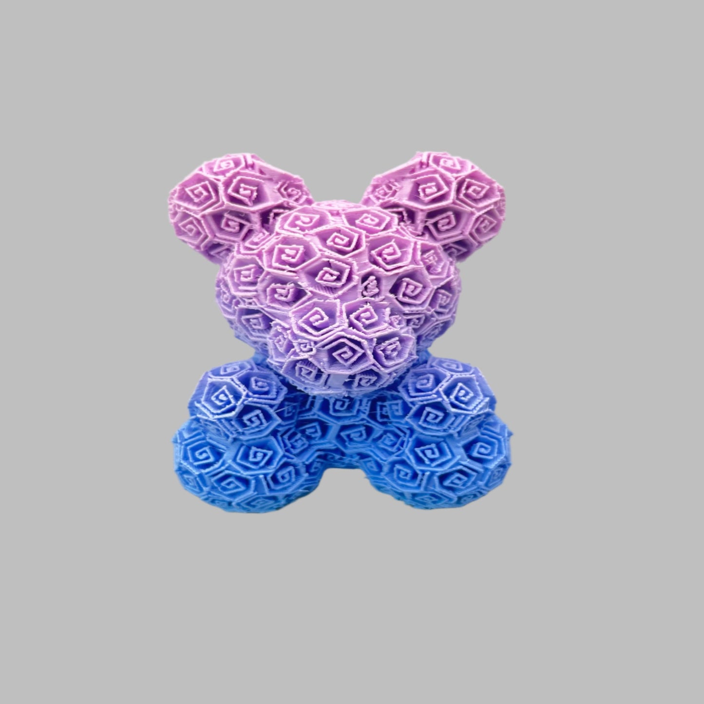 A 3D printed bear covered entirely in small textured roses
