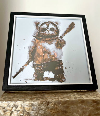 A 3D printed textured picture of an Ewok in a black frame, freestanding on a gold plinth