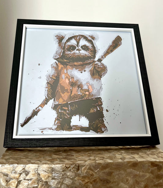 A 3D printed textured picture of an Ewok in a black frame, freestanding on a gold plinth