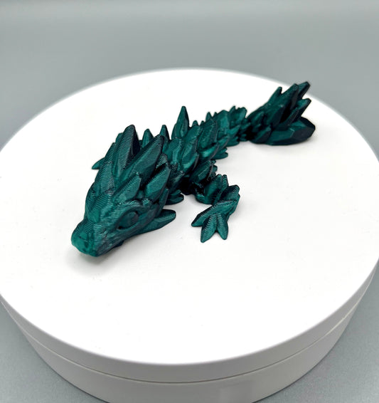 3D printed compact sized gem dragon with small rounded spikes all over, from head to tail