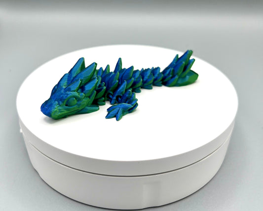 3D printed compact sized gem dragon with small rounded spikes all over, from head to tail