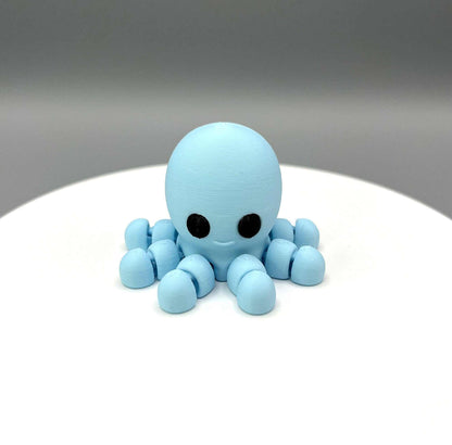 A 3D Printed Octopus Mini Figure with articulated legs and a cute face, perfectly pocket sized