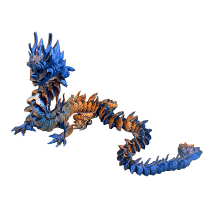A 3D-printed figurine of a colourful Imperial Dragon with a detailed design, featuring a mix of blue and orange hues. Set against a white background.