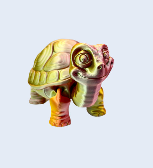 A cute 3D printed reddish orange and gold shiny tortoise with detailed face, shell and legs