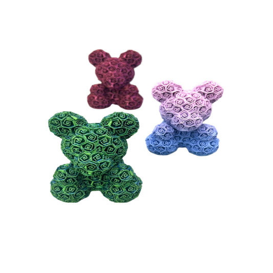 A collection of three 3D printed bears covered entirely in small textured roses
