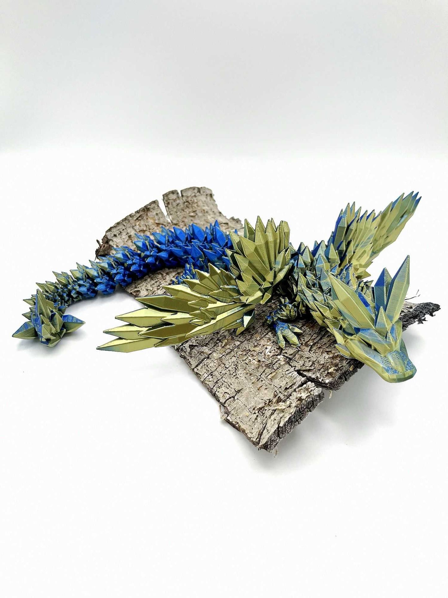 This medium sized winged crystal dragon has beautiful detailing including crystal spikes all over its body from nose to tail and has wings that retract too, making it look very majestic!